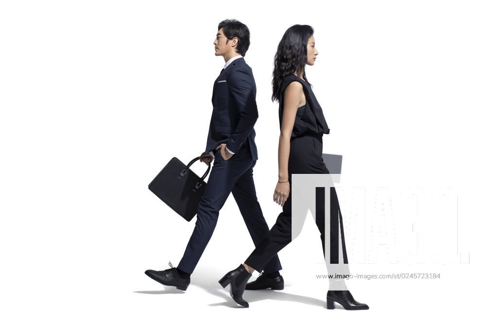 Confident Chinese business people walking Beijing China