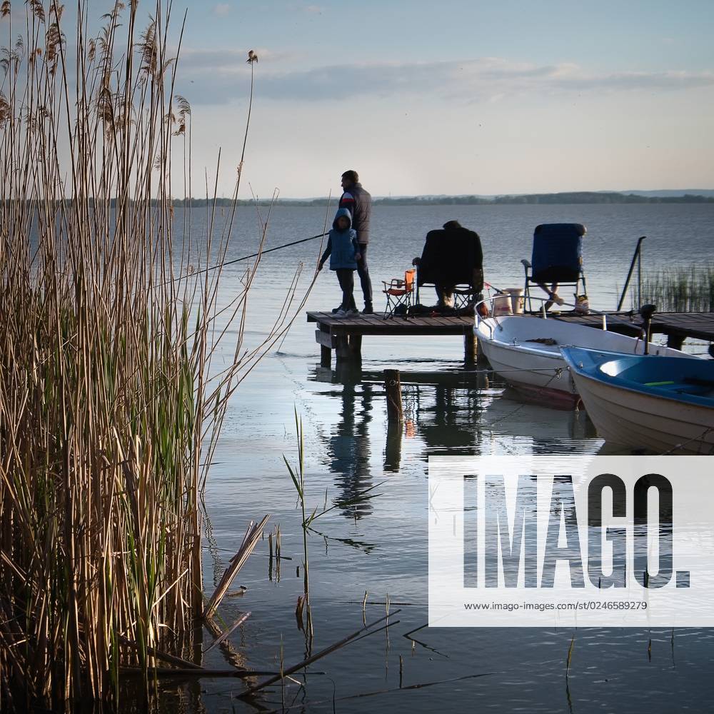 Fishing boats on Hungary s Lake Balaton at sunset on April 30, 2023. (CTKxPhoto PetrxMalina) CTKPhotoF202305040003601 CTKPhotoF202305040003601