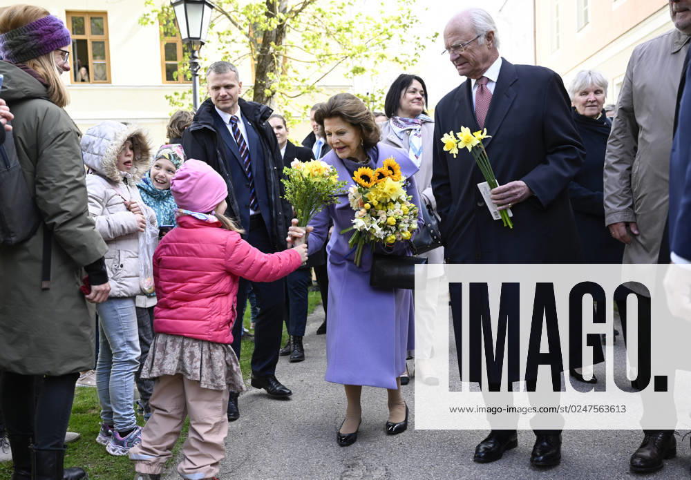 Queen Silvia and King Carl Gustaf greet children outside a university The King and Queen are on an official visit to Estonia 2 4 May 2023 TARTU ESTONIA