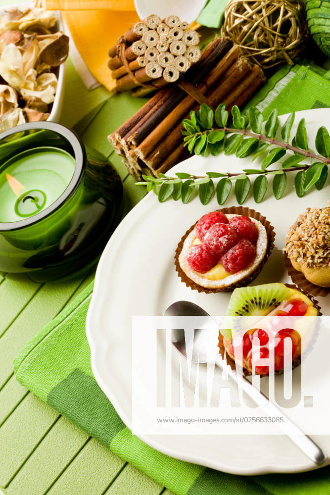 Photo of delicious dessert plate with italian fruits pastries
