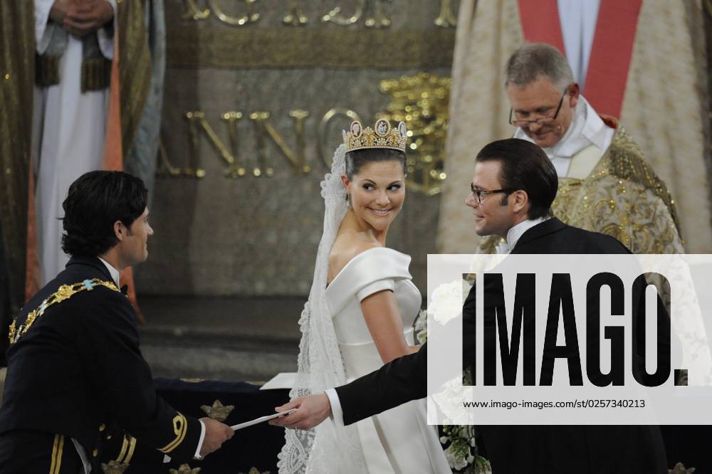 STOCKHOLM 20100619 Princess Victoria and prince Daniel seen after having exchanged wedding rings during the wedding ceremony in Stockholm Cathedral in Stockholm, Sweden, June 19, 2010 Prince Carl Philip congratulating the new prince STOCKHOLM SVERIGE