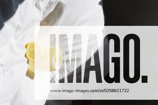 A closeup of a lemon juice with lemons on the bed *** einer closeupe des einer Zitrone Saft mit Zitronen am der Bett 4983788 RECORD DATE NOT STATED