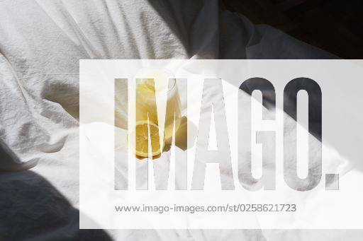 A closeup of a lemon juice with lemons on the bed *** einer closeupe des einer Zitrone Saft mit Zitronen am der Bett 4983789 RECORD DATE NOT STATED