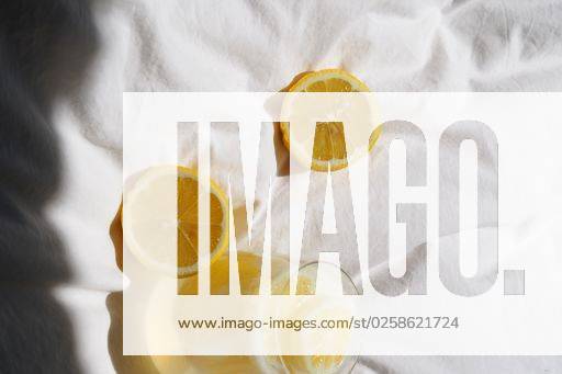 A closeup of a lemon juice with lemons on the bed *** einer closeupe des einer Zitrone Saft mit Zitronen am der Bett 4983821 RECORD DATE NOT STATED