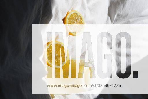 A closeup of a lemon juice with lemons on the bed *** einer closeupe des einer Zitrone Saft mit Zitronen am der Bett 4983823 RECORD DATE NOT STATED