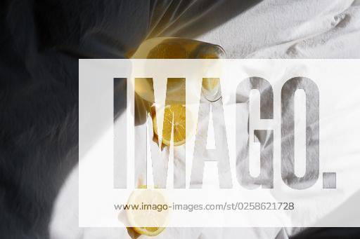 A closeup of a lemon juice with lemons on the bed *** einer closeupe des einer Zitrone Saft mit Zitronen am der Bett 4983828 RECORD DATE NOT STATED