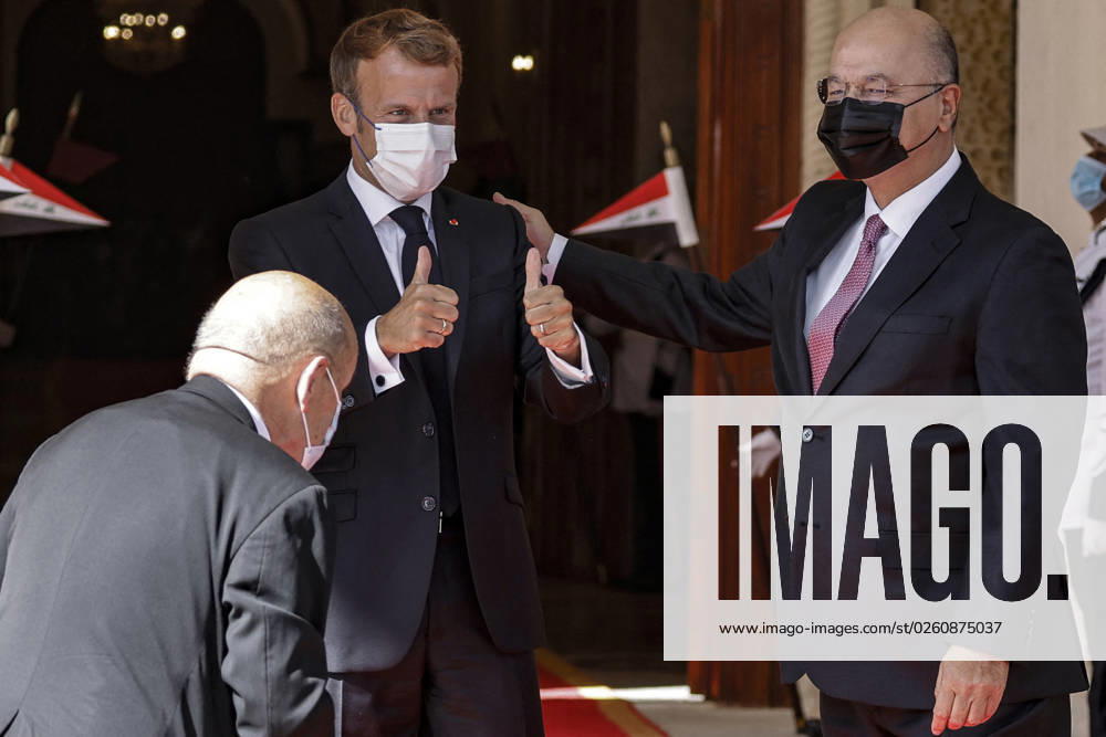 French President Emmanuel Macron in Baghdad - Iraq Iraqi President Barham Saleh (R) welcomes his French counterpart Emmanuel Macron (C) in Baghdad on August 28, 2021. - Macron is among leaders set to attend a regional summit today in Iraq, with the Taliban s takeover of Afghanistan and a deadly jihadist attack in Kabul overshadowing the meeting. Photo by Ludovic Marin pool ABACAPRESS;COM Baghdad Iraq