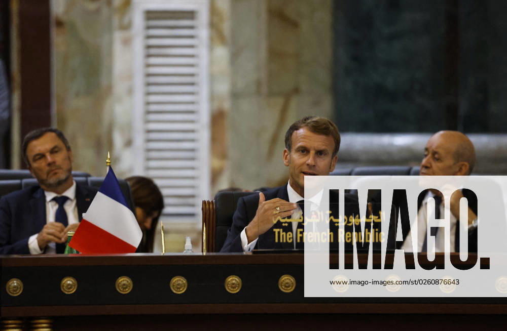 French President Emmanuel Macron in Baghdad - Iraq French President Emmanuel Macron speaks (C), accompanied by French Foreign Affairs Minister Jean-Yves Le Drian (R), during the Baghdad conference in the Iraqi capital on August 28, 2021. (Photo by Ludovic MARIN POOL ABACAPRESS.COM Baghdad Iraq