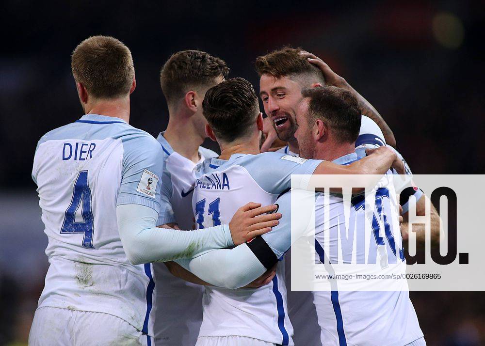 Wembley Stadium, London, England. World Cup Qualifying Football. England versus Scotland. Gary Cahill celebrates with team mates after heading past Scotland Keeper Craig Gordon making it 3-0 Kertonx ActionPlus11808500