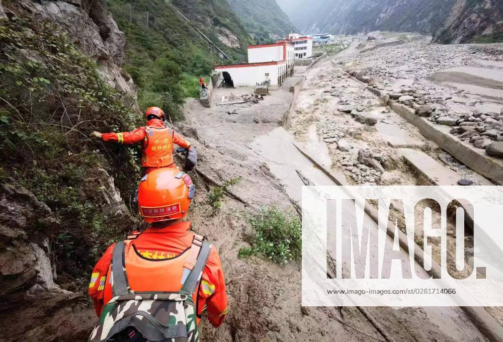 (230627) -- WENCHUAN, June 27, 2023 -- Rescuers work at a landslide site in Miansi Township of Wenchuan County, southwest China s Sichuan Province, June 27, 2023. Seven people have been unaccounted for after landslides hit a county in Sichuan Province in the wee hours of Tuesday. Due to heavy rainfall in a short period of time, landslides occurred in Miansi Township and Weizhou Township in Wenchuan County, the county s emergency management bureau said. As of 10:32 a.m. Tuesday, over 900 people affected by the landslides had been relocated. Over 400 rescue workers are searching for the missing. CHINA-SICHUAN-WENCHUAN-LANDSLIDES (CN) WangxXi