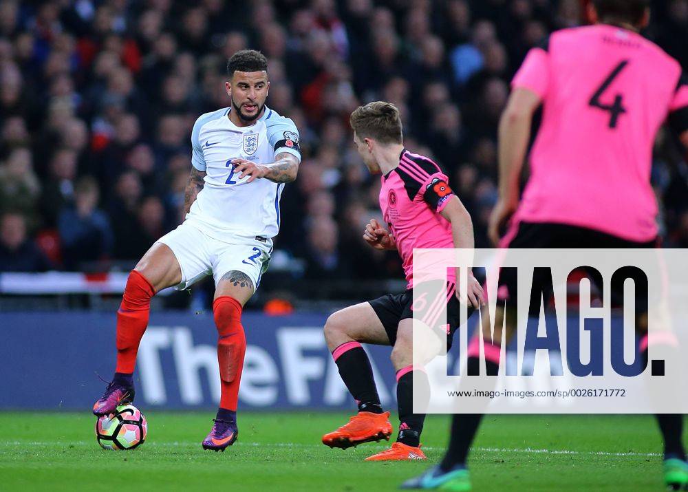Wembley Stadium, London, England. World Cup Qualifying Football. England versus Scotland. Kyle Walker of England turns on the ball as James Forrest of Scotland closes him down Kertonx ActionPlus11808625