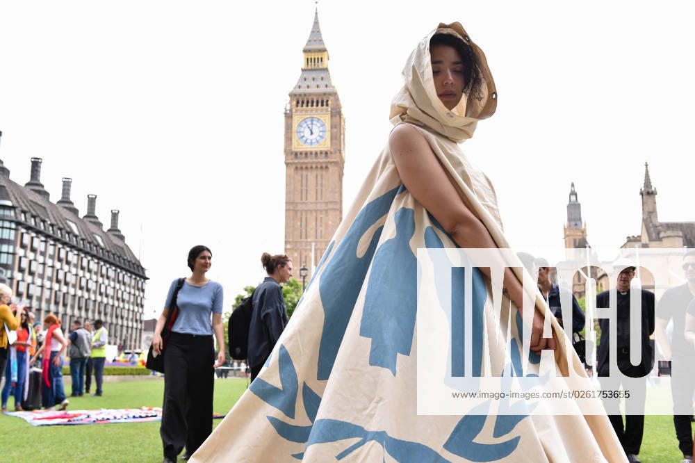 The activist is wearing a real UNHCR camp tent, where a Syrian family lived in one of the refugee camps in Jordan. Grassroots Activist group Citizens UK and school children protest against the GovernmentÃ¢â‚¬â ¢s Illegal Migration Bill which could detain kids. Under the legislation, youngsters arriving in the UK aboard inflatables crossing the Channel could be deported. London United Kingdom - ZUMAk172 20230627_zip_k172_053