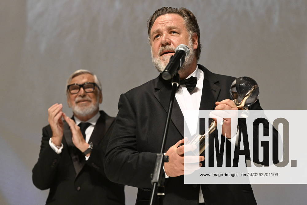 Actor Russell Crowe, right, received Crystal Globe award for contribution to world cinema from Festival President Jiri Bartoska, left, during the opening ceremony of the 57th Karlovy Vary International Film Festival (KVIFF), on June 30, 2023, at the Thermal Hotel in Karlovy Vary, Czech Republic. (CTKxPhoto KaterinaxSulova) CTKPhotoP2023063007849 CTKPhotoP2023063007849