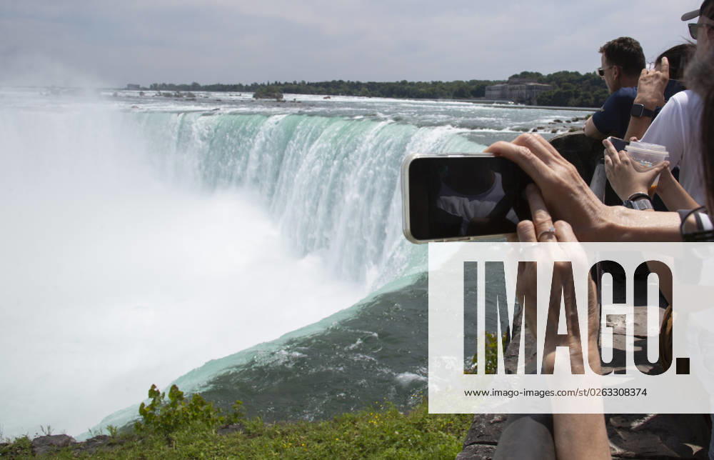 July 10, 2023. Niagara Falls is composed of three waterfalls at the Southern end of the Niagara River Gorge. It drains Lake Erie into Lake Ontario and defines the United States Canada border between the twin cities of Niagara Falls, Ontario and Niagara Falls, New York. Horseshoe Falls is nearest the Canadian shore and can be seen from the walk along the shoreline in Niagara Park. Niagara Fallas Canada - ZUMAl92_ 20230708_zaf_l92_022