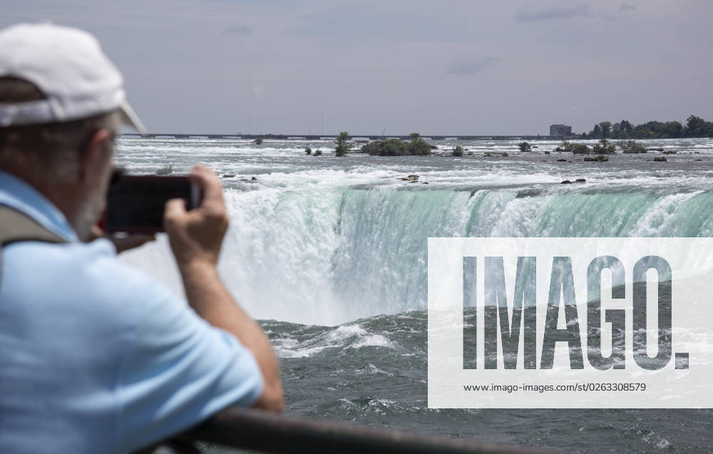 July 10, 2023. Niagara Falls is composed of three waterfalls at the Southern end of the Niagara River Gorge. It drains Lake Erie into Lake Ontario and defines the United States Canada border between the twin cities of Niagara Falls, Ontario and Niagara Falls, New York. Horseshoe Falls is nearest the Canadian shore and can be seen from the walk along the shoreline in Niagara Park. Niagara Fallas Canada - ZUMAl92_ 20230708_zaf_l92_029