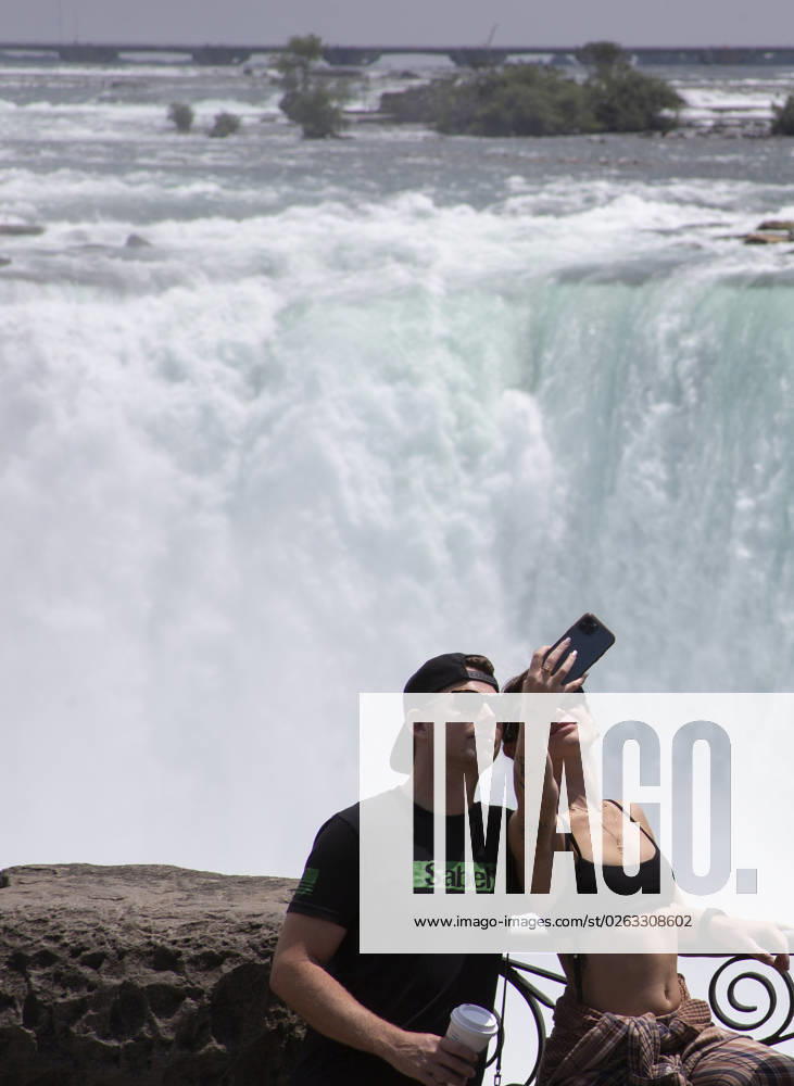 July 10, 2023. Niagara Falls is composed of three waterfalls at the Southern end of the Niagara River Gorge. It drains Lake Erie into Lake Ontario and defines the United States Canada border between the twin cities of Niagara Falls, Ontario and Niagara Falls, New York. Horseshoe Falls is nearest the Canadian shore and can be seen from the walk along the shoreline in Niagara Park. Niagara Fallas Canada - ZUMAl92_ 20230708_zaf_l92_032