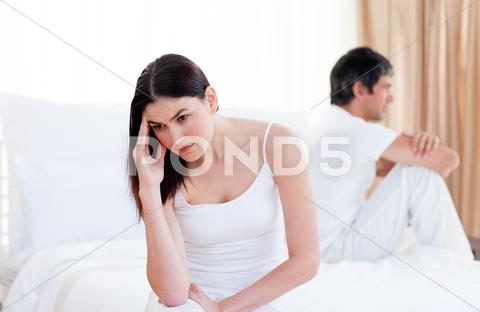 Angry couple having an argument sitting on bed at home bed,man,wife,home,glum,riled,vexed,irate,woman,morbid,gloomy,dismal,ireful,lovers,bitter,couple,divorce,married,unhappy,annoyed,husband,bedroom,indoors,offended,troubled,mournful,argument,bereaved,affronted,depressed,boyfriend,irascible,irritable,valentine,resentful,interiors,despairing,despondent,melancholy,distressed,infuriated,girlfriend,displeased,exasperated,exacerbated,pessimistic,relationship,low-spirited,heterosexual,disconsolate