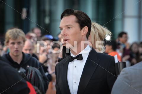 cast member benedict cumberbatch arrives for the premiere of the fifth estate at the 38th toronto international film festival on september 5, 2013. the movie is based on the true-life story of wikileaks founder julian assange. 2013, actors, canada, carpet, celebrity, cinema, crowd, editorial, entertainment, event, famous, fans, festival, film, film festival, hollywood, movie, people, photo, photocall, premier, premiere, red, september, star, tiff, toronto