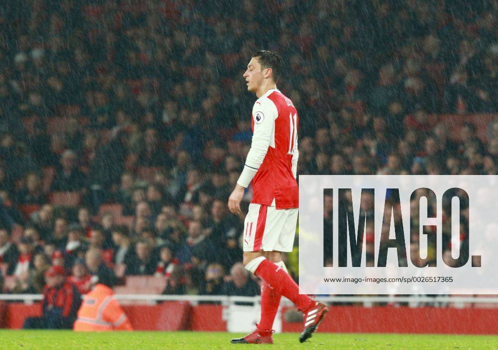 Arsenal v Stoke City . . London, UK . . 10.12.2016 Mesut Ozil (A) in the pouring rain.