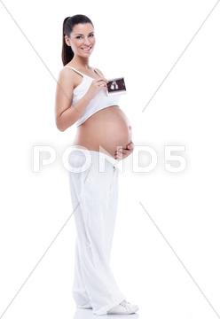 Pregnant woman holding ultrasound image pregnant, woman, ultrasound, belly, pregnancy, healthcare, medical scan, beautiful, care, medicine, test, results, analyzing, fertility, baby, abdomen, motherhood, happiness, touching, examination, fetus, healthy lifestyle, showing, caressing, photography, stomach, expectant, young, standing, new life, mother, female, casual, parent, beginnings, women, freshness, lifestyles, caucasian, people, 25s, serene, adult, person, horizontal