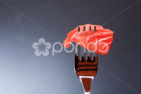 Closeup of steel fork with slice of salmon on dark background Salmon, Trout, Chinook, Fish, Snack, Appetizer, Gourmet, Meal, Food, Cooking, Restaurant, Portion, Slice, Eating, Seafood, Delicacy, Salted, Fork, Silverware