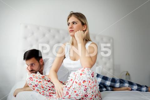 Woman and man having conflict and going through crisis in relationship couple, impotence, boyfriend, cheating, conflict, crisis, depression, divorce, unfaithful, girlfriend, man, married, problem, stress, unhappy, woman, bed, angry, argument, bedroom, break up, disagreement, family, frustration, husband, partner, intimate, lover, marriage, sad, separation, together, two, wife, worried, young, sex, trouble