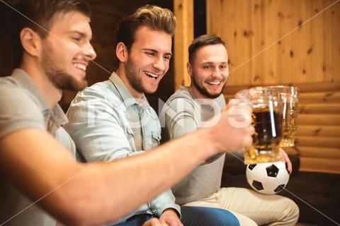 All photos are made of RAW output.We use hi-end cameras and lenses to get perfect quality.We've got videos similar to photos from our shootings. hands, gesture, friends, men, sit, emotion, enjoy, fans, football, fun, game, goal, home, match, people, soccer, three, victory, win, beer, drink, happy, look, smile, success, holiday, house, lifestyle, rest, room, triumph, alcohol, relax, ball, male, friendship, glass, accent, focus, leisure, pub, bar, pint, group, celebration, clink, advertisement, portrait, faces, hold