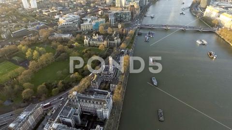 London Rooftop View Panorama at Sunset with Urban Architectures around Lambeth Palace, Archbishop's Park and Thames River panorama, lambeth palace, architecture, urban, rooftop, 4k, aerial point of view, archbishop, morton tower, above, aerial cityscape, aerial landscape, aerial view, air, aircraft point of view, altitude, birds eye view, bridge, britain, canal, directly above, drone, drone shot, england, fly, high, historical, horizontal, lambeth, landmark, library, london, mid-air, overhead, palace, park, photography, quadcopter, residence, river, riverside, roof, skyline, thames, uk, united kingdom, water, waterway, wide shot