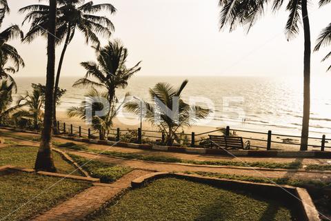 Panorama landscape view of a beautiful tropical sea beach in sunset time during christmas holiday. ( MUMBAI, MAHARASTRA, INDIA). Travel vacation and holiday concept. silhouette, vacation, sunrise, resort, summer, sun, sky, paradise, palm-tree, travel, coconut, orange, nature, exotic, dusk, trees, yellow, island, ocean, evening, background, light, twilight, sunlight, scenery, tranquil, scene, water, leaf, sundown, golden, caribbean, maldives, tropic, coastal-sand, thailand, holiday, colorful, shore-coast, asia, lagoon, miami, hawaii, islands, bali, morning, lucia, bahamas, jamaica, wave