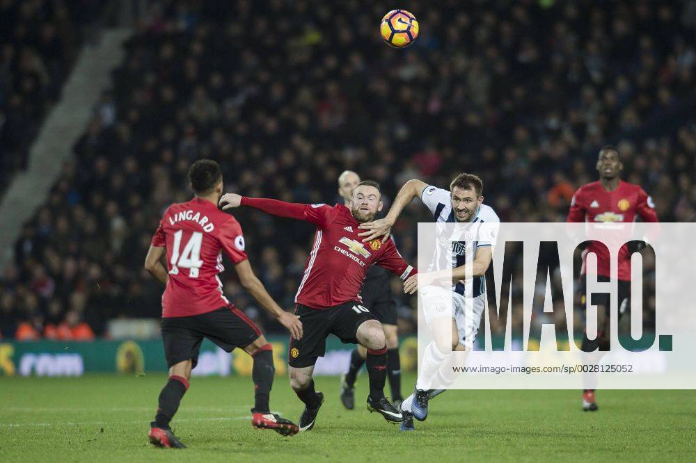 Wayne Rooney of Manchester United ManU tussles with Gareth McAuley of West Bromwich Albion during the Premier League match between West Bromwich Albion and Manchester United at The Hawthorns, West Bromwich, England on 17 December 2016.