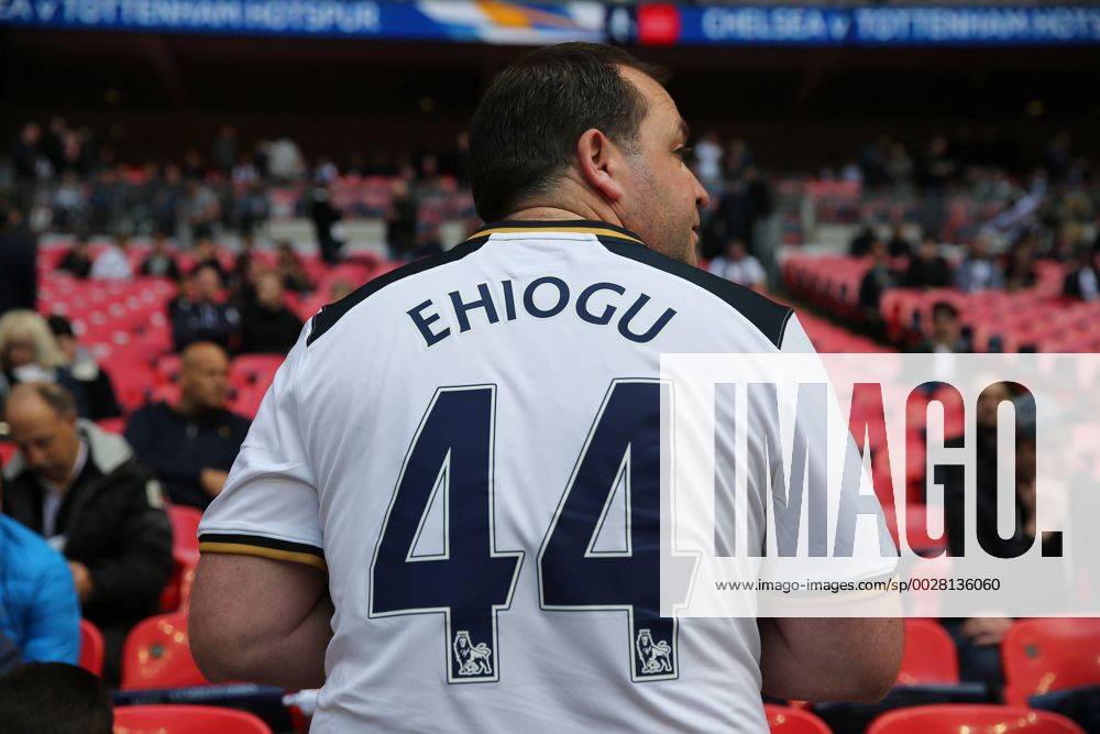 - SPORT April 22nd 2017, Wembley Stadium, London England; Emirates FA Cup semi-final Chelsea versus Tottenham Hotspur; Spurs fan wearing home shirt with Ugo Ehiogu on the back in Tribute on the big screen outside Wembley Stadium to former Aston Villa and England International Ugo Ehiogu who passed away yesterday PatrickxFletcherx ActionPlus11870748