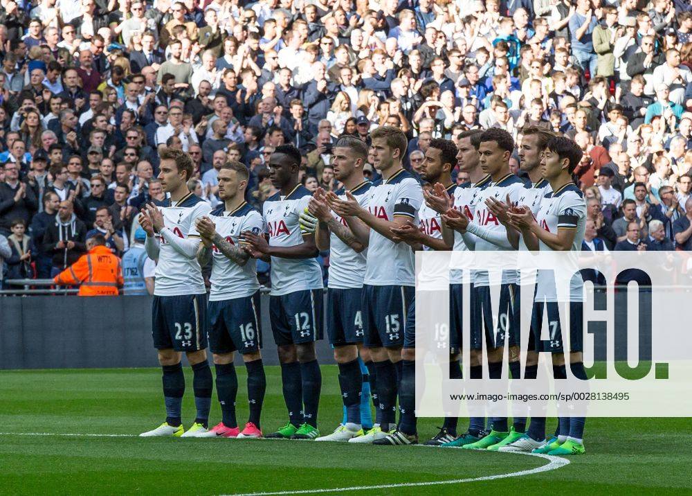 Spurs players observe a minute applause before the match in remembrance Ugo Ehiogu the Tottenham Hotspur under 23 coach that passed away suddenly on 21 04 2017 during the the Emirates FA Cup Semi-Final match between Chelsea and Tottenham Hotspur at Wembley Stadium, London, England on the 22nd April 2017.