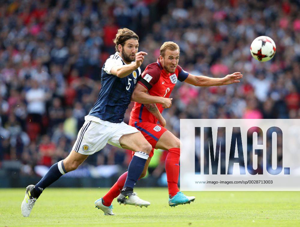 Scotland s Charlie Mulgrew tussles with England s Harry Kane during the FIFA World Cup WM Weltmeisterschaft Fussball Qualifying match at Hampden Park Stadium, Glasgow Picture date 10th June 2017. Picture credit should read: David Klein Sportimage .
