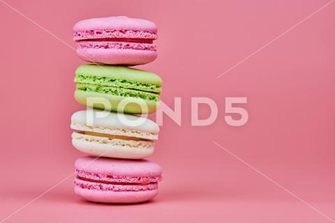 Macaroons on pink background. Colorful small cookie from ground almonds and coconut. Popular confectionery. Tasty snack food for take away, copy space macaroons, macaroon, macaron, pink, colorful, confectionery, cookie, popular, copy space, cake, pastry, cupcake, shortcake, tasty, food, design, snack, take, away, ground, almonds, coconut, small, red, studio, bunch, green, beige, dessert, pastel, different, assorted, cuisine, cafe, vintage, bakery, candy, sweet, french, sandwich, color, desert, sweetness, honey, goody, flavor, gourmet, breakfast, delicious, column