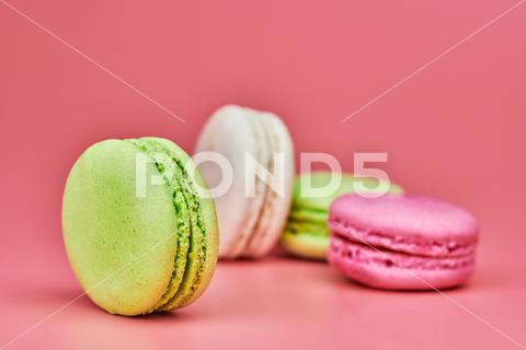 Macaroons on pink background. Colorful small cookie from ground almonds and coconut. Popular confectionery. Tasty snack food for take away, copy space macaroons, macaroon, macaron, pink, colorful, confectionery, cookie, popular, copy space, cake, pastry, cupcake, shortcake, tasty, food, design, snack, take, away, ground, almonds, coconut, small, red, studio, bunch, green, beige, dessert, pastel, different, assorted, cuisine, cafe, vintage, bakery, candy, sweet, french, sandwich, color, desert, sweetness, honey, goody, flavor, gourmet, breakfast, high-calorie, delicious