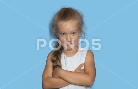 Mischievous little gir with curly hairl making sarcastic face, like seriously, perfect use for memes. A portrait of an caucasian beautiful girl. adorable, hair, happiness, happy, indian, isolated, joy, kid, little, model, people, person, portrait, pretty, small, smile, young, girl, gesture, innocent, attractive, beautiful, funny, cheerful, child, childhood, carefree, expression, emotion, face, cute, youth, curious, excited, sarcastic, imitation, caucasian, surprise, looking, female, studio, healthy, lovely, human, head, children, preschool, confidence, advertising, surprised