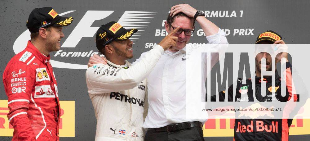 Ferrari s German driver Sebastian Vettel, Mercedes British driver Lewis Hamilton, Mercedes AMG Managing Director Andy Cowell and Red Bull s Australian driver Daniel Ricciardo celebrate on the podium after the Spa-Francorchamps Formula One Grand Prix of Belgium race, in Spa-Francorchamps, Sunday 27 August 2017. BENOITxDOPPAGNE x05153374x