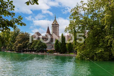 National Swiss Historical Museum In Zurich. Limmat river zurich, switzerland, architecture, swiss, national, history, museum, building, landmark, art, tower, historical, old, city, european, fortress, brick, culture, europe, travel, historic, castle, famous, mediaeval, medieval, ancient, facade, landesmuseum, tile, bicycle, bike, cloud, europa, sky, spire, national museum, park, street, summer, downtown, traffic, window, ages, people, avenue, entrance, lane, urban, vintage, blue
