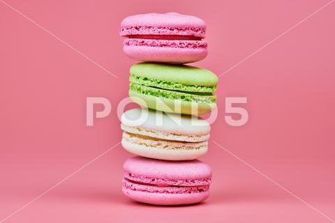 Macaroons on pink background. Colorful small cookie from ground almonds and coconut. Popular confectionery. Tasty snack food for take away, copy space macaroons, macaroon, macaron, pink, colorful, confectionery, cookie, popular, copy space, cake, pastry, cupcake, shortcake, tasty, food, design, snack, take, away, ground, almonds, coconut, small, red, studio, bunch, green, beige, dessert, pastel, different, assorted, cuisine, cafe, vintage, bakery, candy, sweet, french, sandwich, color, desert, sweetness, honey, goody, flavor, gourmet, breakfast, delicious, column