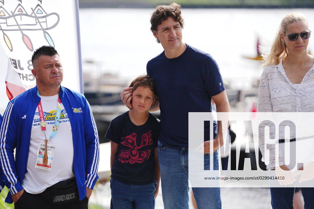 Prime Minister Justin Trudeau, second from right, and his son Hadrien, second from left, share a moment prior to the Canoe Kayak competition at the North American Indigenous Games 2023 in Halifax, Monday, July 17, 2023. Halifax Canada - ZUMAc35_ 20230717_zaf_c35_069