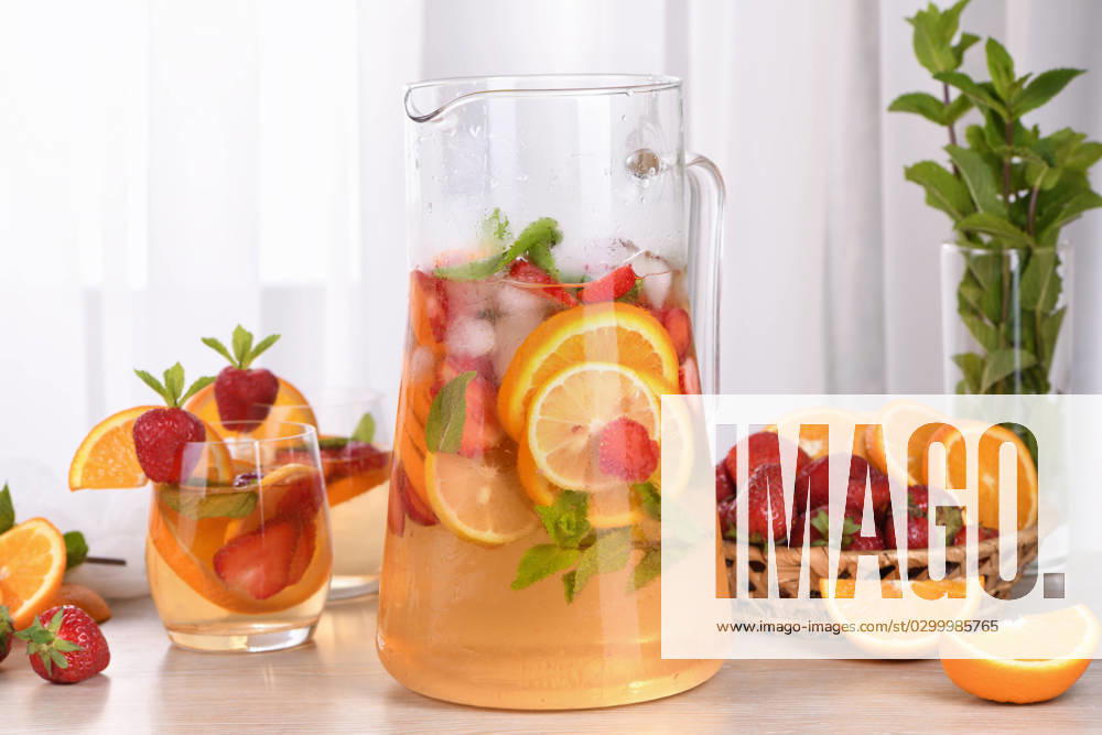 Summer Sangria cocktail Summer Sangria cocktail or lemonade with strawberry, orange and mint. Refreshing organic non-alcoholic, Detox vitaminized healthy drink, fruit in a glass