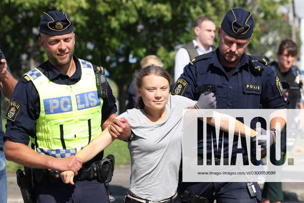 MALMÖ 20230724 Climate activist Greta Thunberg is taken away by police as she takes part in a new climate action in the Oil Harbour in Malmö on Monday The action comes just hours after Thunberg was sentenced to a daily fine for a similar action on June 19 - also in the Oil Harbour MALMÖ Sweden