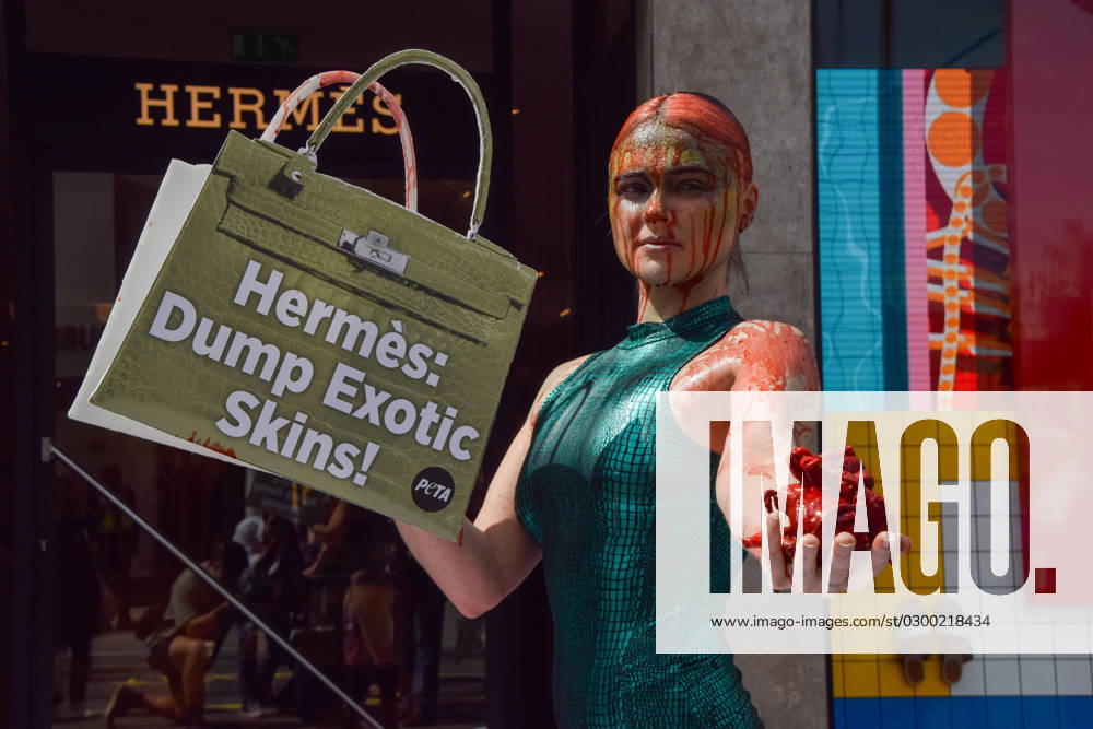 Vegan activist TASH PETERSON and PETA staged a protest outside the Hermes store on Bond Street, calling on the luxury brand to end the use of crocodile skins in their products. The activist was drenched in fake blood and guts. London United Kingdom - ZUMAv130 20230726_zip_v130_024