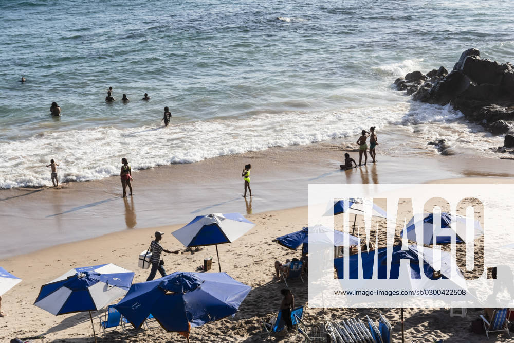 Beach scene on a busy spring day with people at leisure at Farol da Barra beach in Salvador, Brazil. Salvador Bahia Brazil