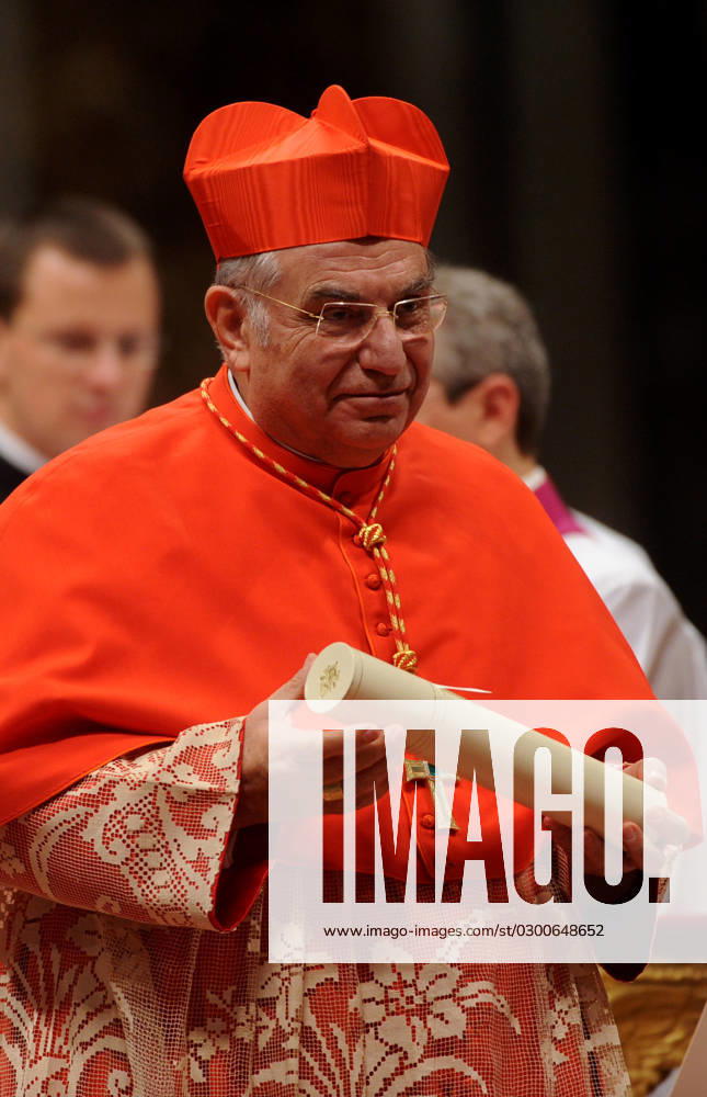 Consistory at the Vatican: Pope Benedict XVI creates 24 new cardinals - Rome New cardinal Paolo Romeo receives the biretta cap from Pope Benedict XVI during the consistory ceremony in Saint Peter s Basilica at the Vatican on November 20, 2010. Pope Benedict XVI formally created 24 new cardinals amid cheers in St. Peter s Basilica, bringing a mostly Italian group into the elite club that will eventually elect his successor.The basilica was awash in red as some 150 cardinals from around the world came to Rome for the occasion of welcoming in their newest members. PHOTO by Eric Vandeville ABACAPRESS.COM Rome Vatican Italy
