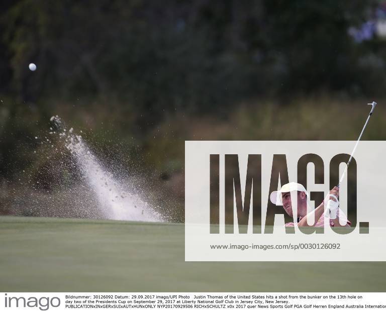 Justin Thomas of the United States hits a shot from the bunker on the 13th hole on day two of the Presidents Cup on September 29, 2017 at Liberty National Golf Club in Jersey City, New Jersey. NYP20170929506 RICHxSCHULTZ