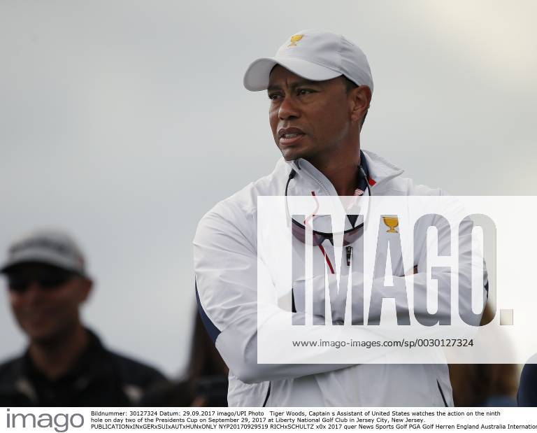 Tiger Woods, Captain s Assistant of United States watches the action on the ninth hole on day two of the Presidents Cup on September 29, 2017 at Liberty National Golf Club in Jersey City, New Jersey. NYP20170929519 RICHxSCHULTZ