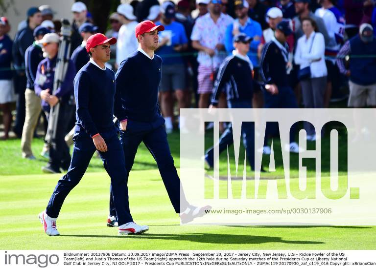 Jersey City, New Jersey, U.S - Rickie Fowler of the US Team(left) and Justin Thomas of the US Team(right) approach the 12th hole during Saturday matches of the Presidents Cup at Liberty National Golf Club in Jersey City, NJ GOLF 2017 - Presidents Cup - ZUMAc119 20170930_zaf_c119_016
