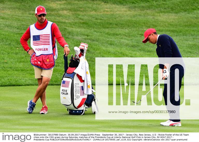 Jersey City, New Jersey, U.S - Rickie Fowler of the US Team chips onto the 15th green during Saturday matches of the Presidents Cup at Liberty National Golf Club in Jersey City, NJ GOLF 2017 - Presidents Cup - ZUMAc119 20170930_zaf_c119_021