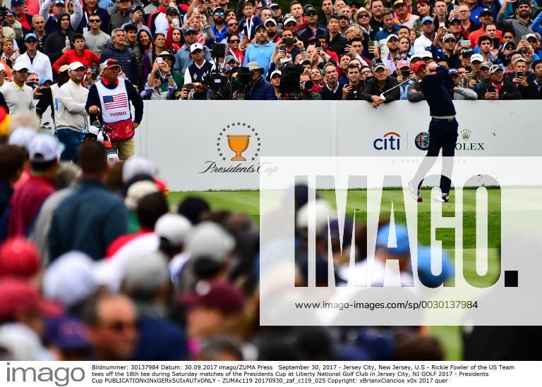 Jersey City, New Jersey, U.S - Rickie Fowler of the US Team tees off the 18th tee during Saturday matches of the Presidents Cup at Liberty National Golf Club in Jersey City, NJ GOLF 2017 - Presidents Cup - ZUMAc119 20170930_zaf_c119_025